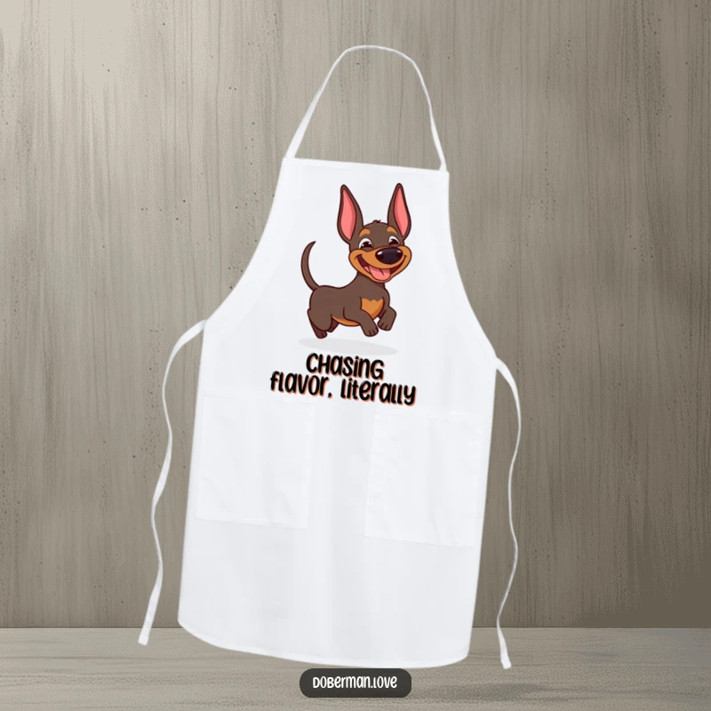 Funny Doberman apron featuring a joyful dog with a wide, silly grin, hilariously chasing its own wagging tail.