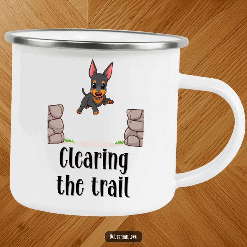 Funny camping mug illustration of a small Doberman puppy attempting a wobbly jump, perfect for outdoor enthusiasts who love cute dogs.