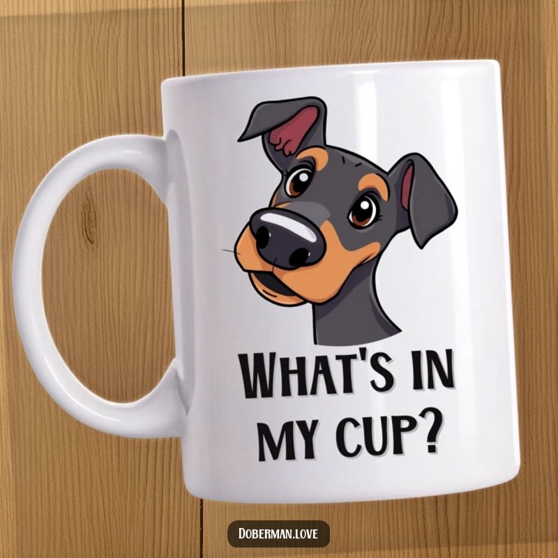 Funny mug showcasing a curious Doberman dog tilting its head with a quizzical and adorable expression.