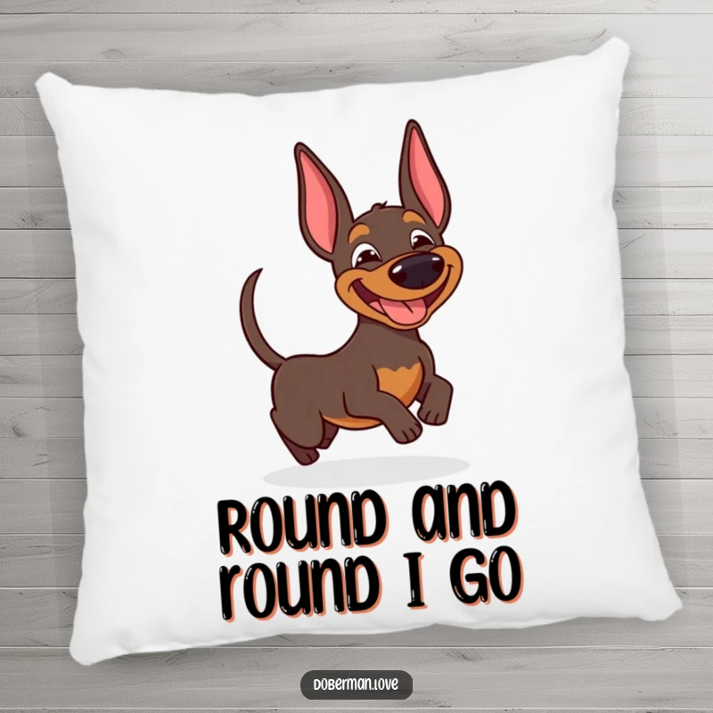 Funny Doberman pillow showing a happy dog with a big goofy smile, playfully spinning after its wagging tail.
