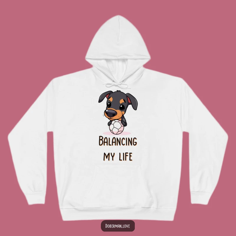 Funny Kawaii Doberman Ball Balance Hoodie: Cozy & Determined Pup Wear
