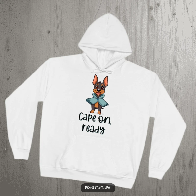 Funny Doberman Hero Hoodie featuring a playful doberman barking happily with a small cape. Comfortable and cute, great for dog lovers and chilly weather.