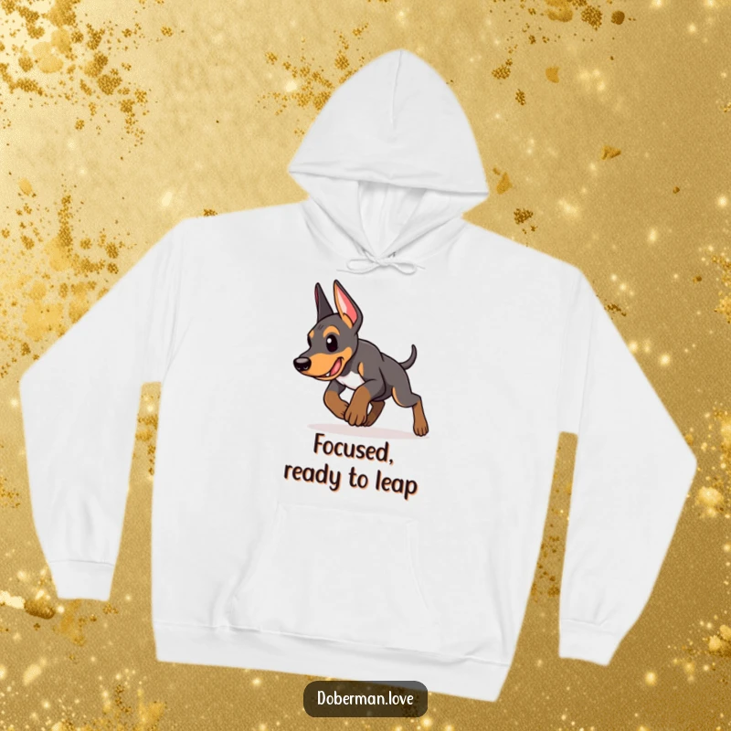 Funny Doberman puppy hoodie featuring an energetic puppy in a determined pounce, embodying focus, drive, and playful intent for comfort.