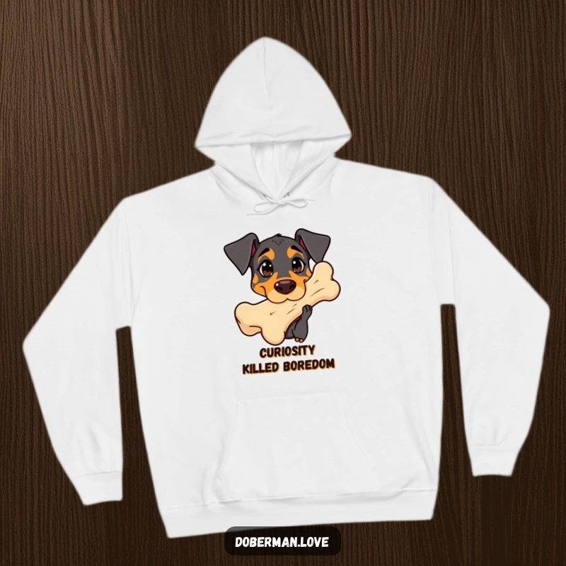 Funny Doberman Hoodie: Cute kawaii dog with curious eyes sniffing a giant bone, embodying gentle curiosity.