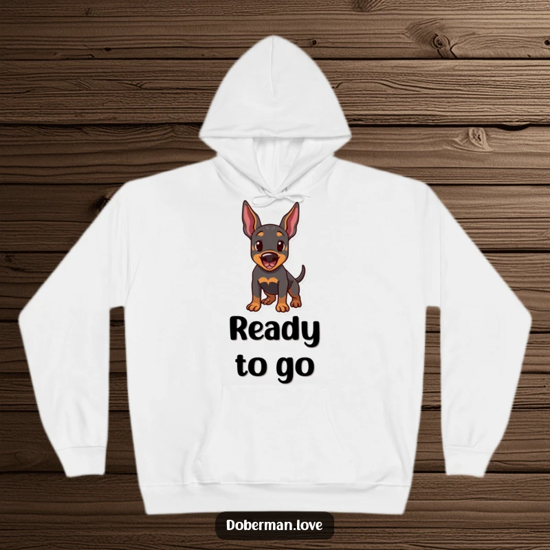 Funny hoodie illustration of a Doberman dog in a playful stance, ears perked and tail wagging. Comfortable and humorous outerwear.