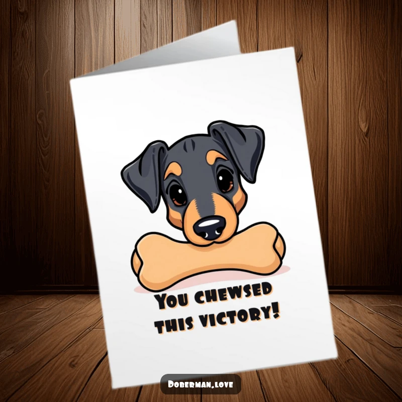 Funny Free Printable Congratulations Card: A Kawaii Doberman peeks from behind a large chew toy, ready to celebrate your win.