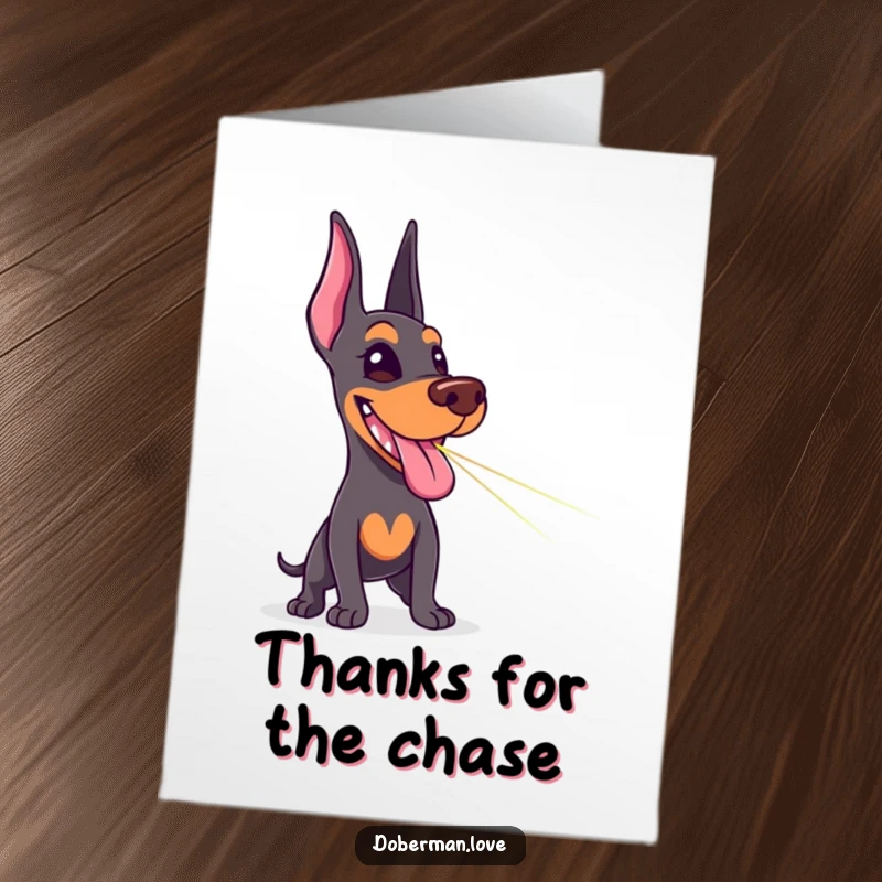Funny Free Printable Doberman Thank You Card: Delighted dog with tongue out, chasing a laser dot, downloadable appreciation.