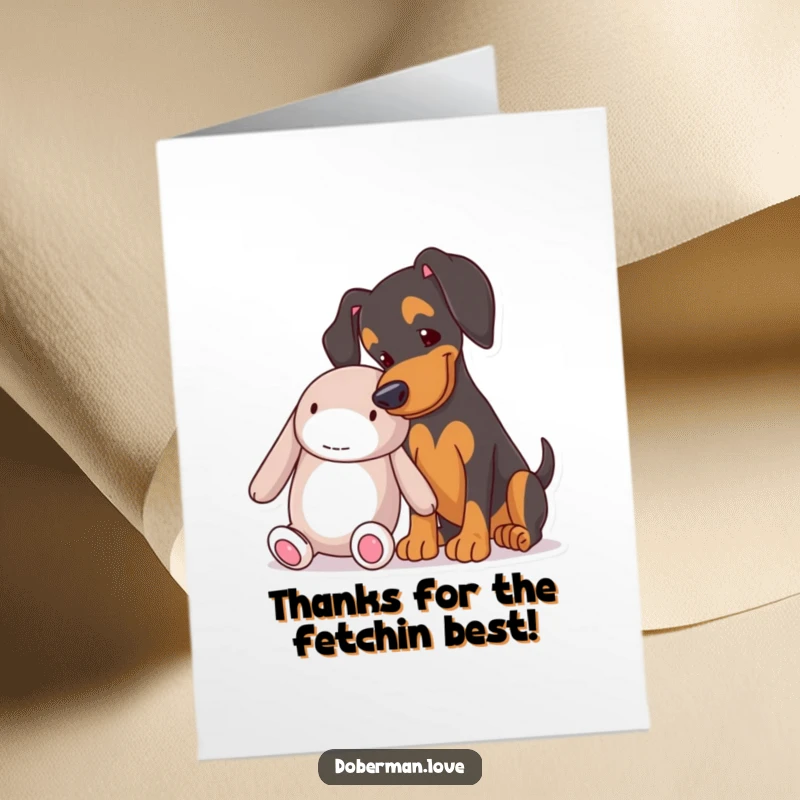 Funny Free Printable Thank You Card: A doberman playfully nudging a big toy, showing appreciation.