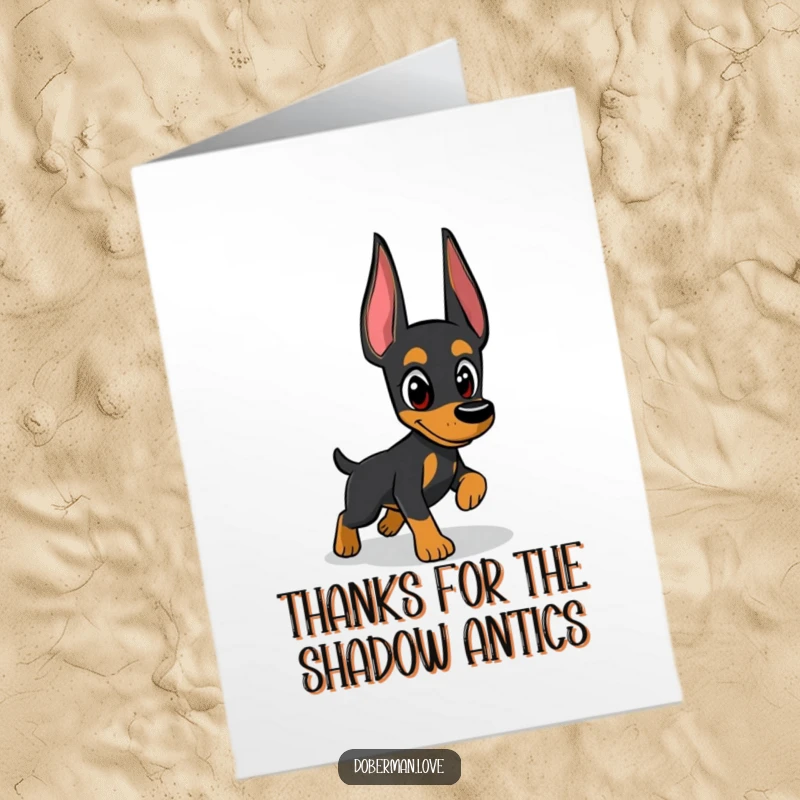 Funny free printable thank you card illustrating a focused Doberman chasing a shadow, a playful way to express gratitude.