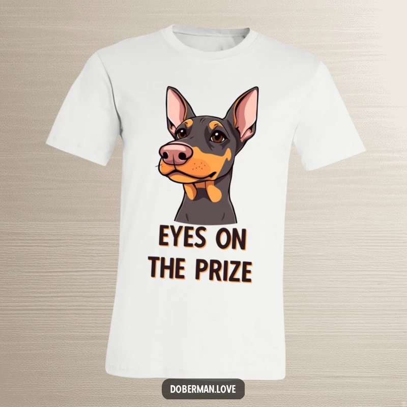 Funny Doberman T-Shirt: Doberman with sharp but kind eyes looking upwards, humorous and heartwarming canine graphic.