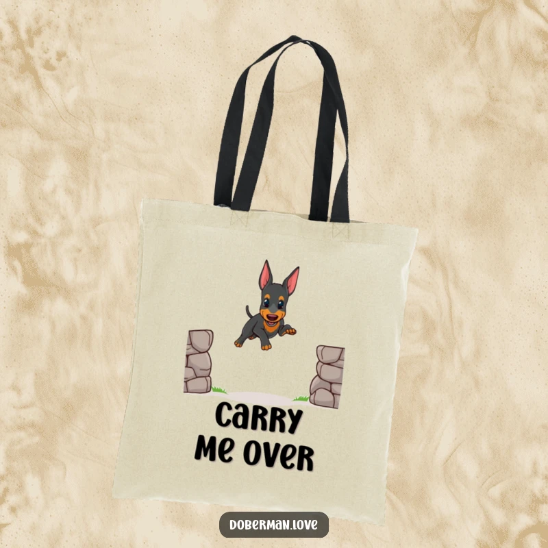 Funny tote bag print of a small Doberman puppy attempting a wobbly jump over a small gap, perfect for carrying items with a smile.
