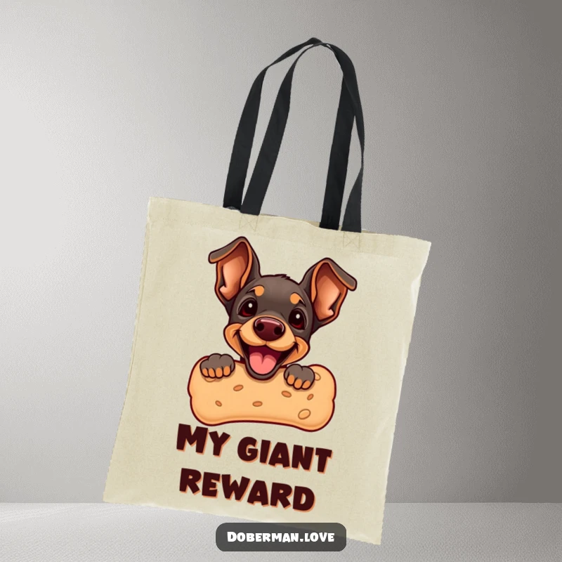 Funny Doberman Puppy Tote Bag featuring a cute puppy peeking from a giant dog biscuit. Durable and fashionable, perfect for shopping and everyday use.